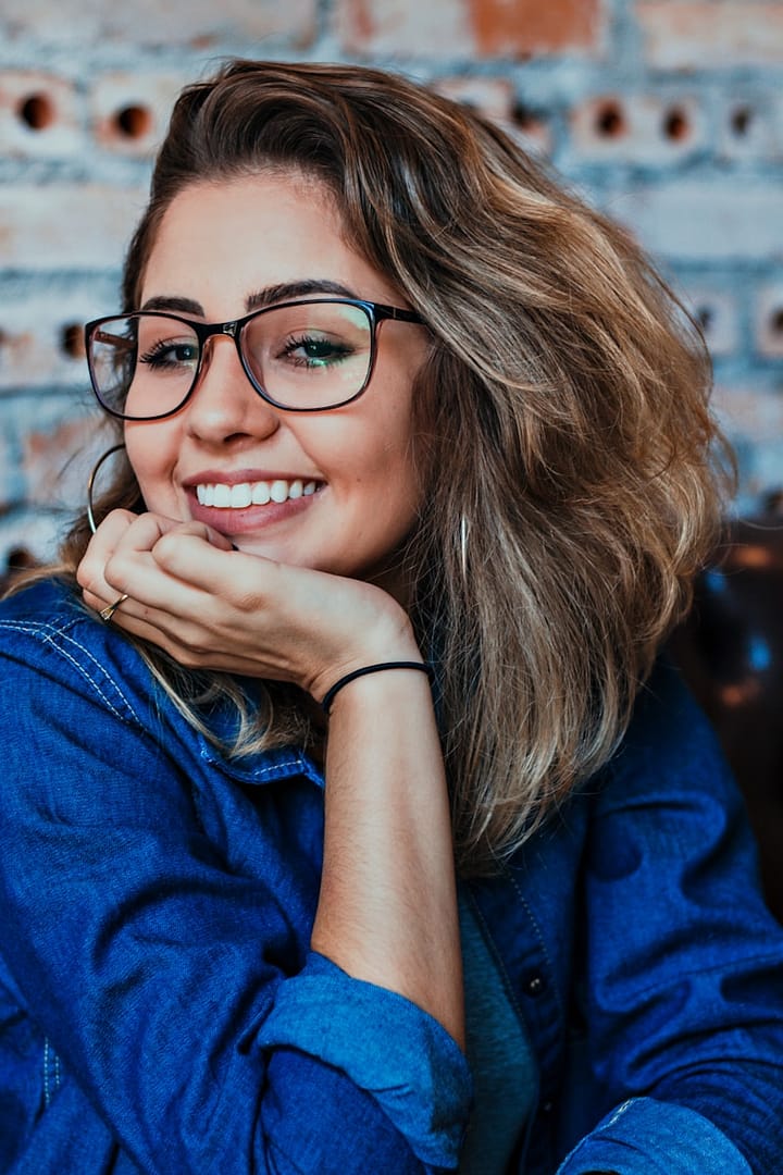 closeup photo of woman wearing black framed eyeglasses